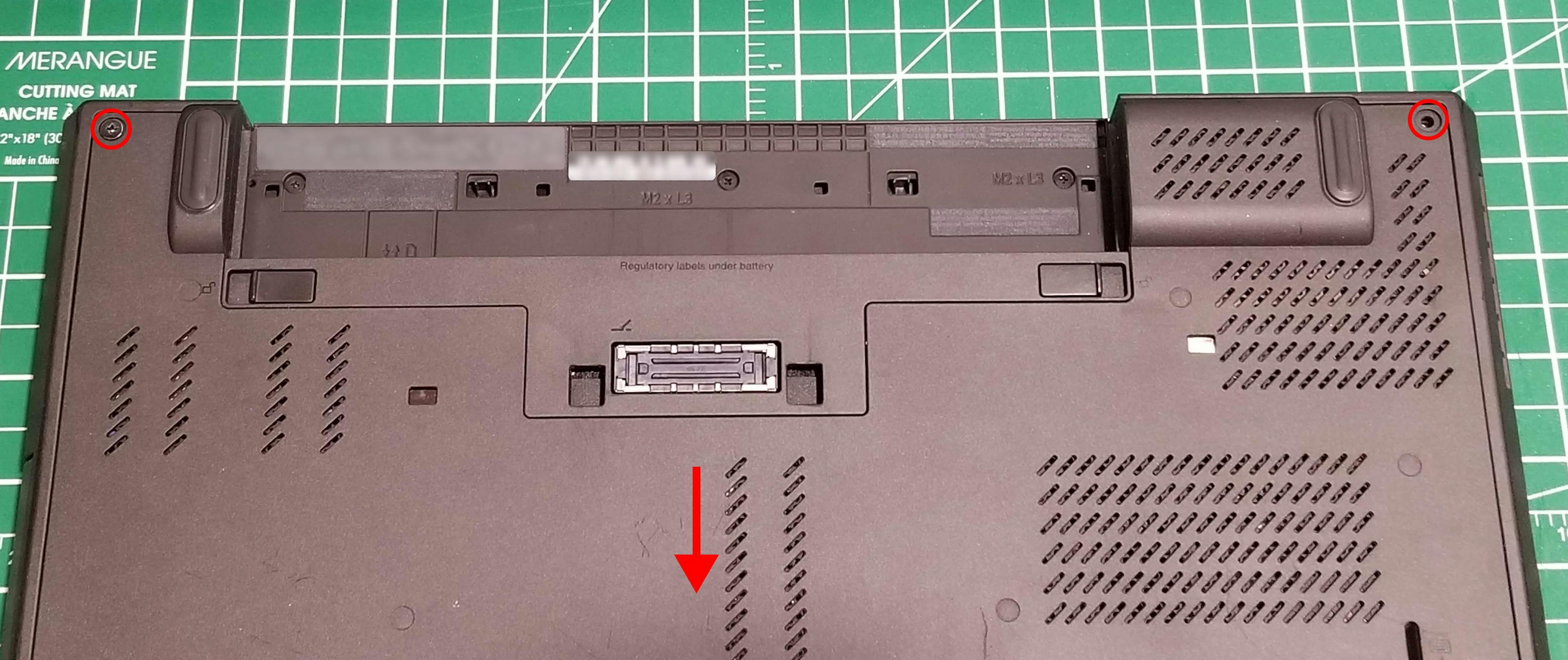 The bottom of a ThinkPad T440p with two screw highlighted and the direction to remove the service panel.