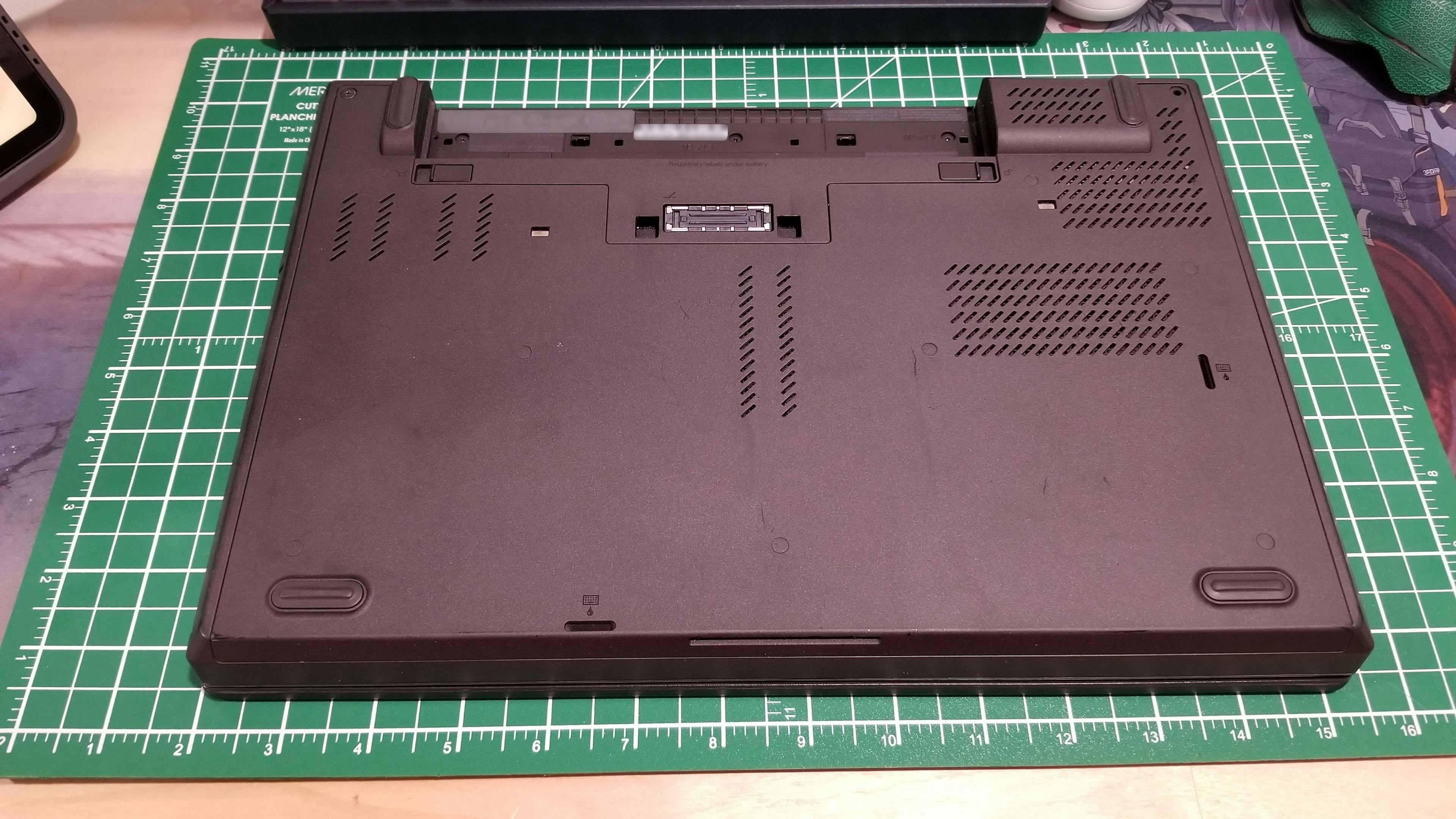 The bottom of a ThinkPad T440p with the battery removed.
